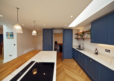 blue shaker kitchen, hidden utility room, designer kitchen, boiling tap, quartz worksurface, open plan kitchen, oak breakfast bar, Siemens, NEFF, Biggleswade, Bedfordshire, Hertfordshire